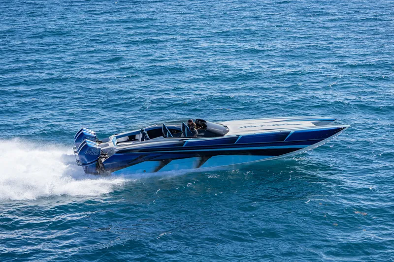 Slide: The Image of 2026 Nor-Tech 4000 Super Catamaran speeding on open water, showcasing sleek design and power. - 24