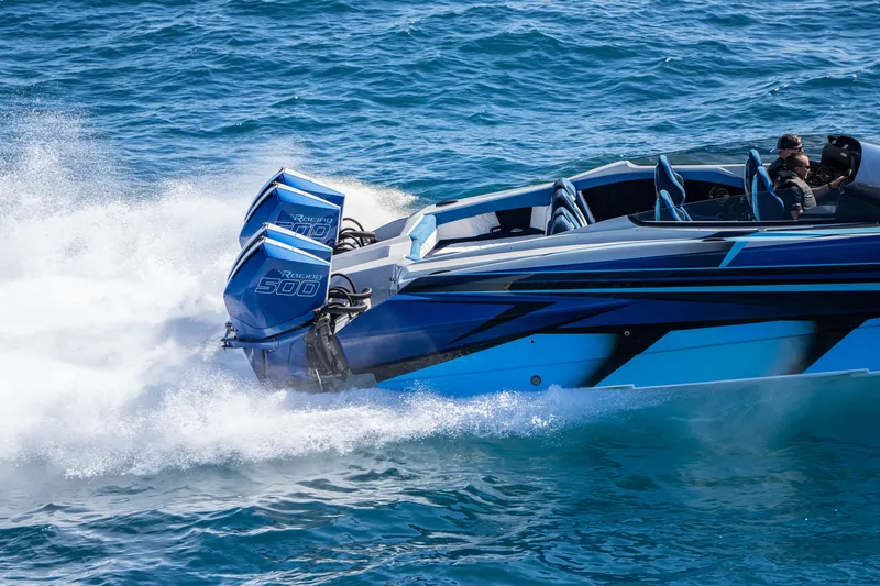 Slide: The Image of 2026 Nor-Tech 4000 Super Catamaran speeding on ocean with twin 500 engines. - 25