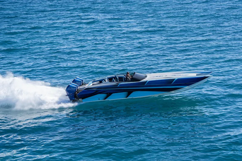 Slide: The Image of 2026 Nor-Tech 4000 Super Catamaran speeding on open water. - 27