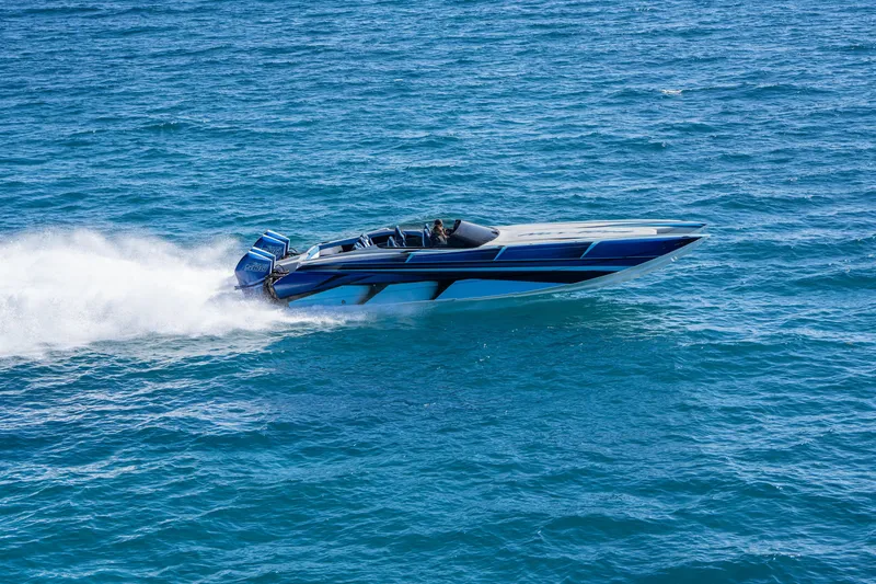 Slide: The Image of 2026 Nor-Tech 4000 Super Catamaran speeding on open water, showcasing sleek design and power. - 3