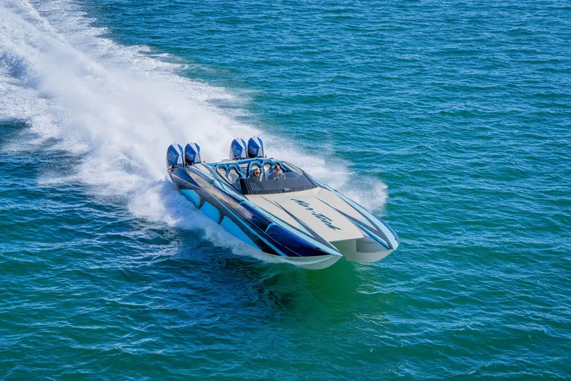 Slide: The Image of 2026 Nor-Tech 4000 Super Catamaran speeding on open water. - 34