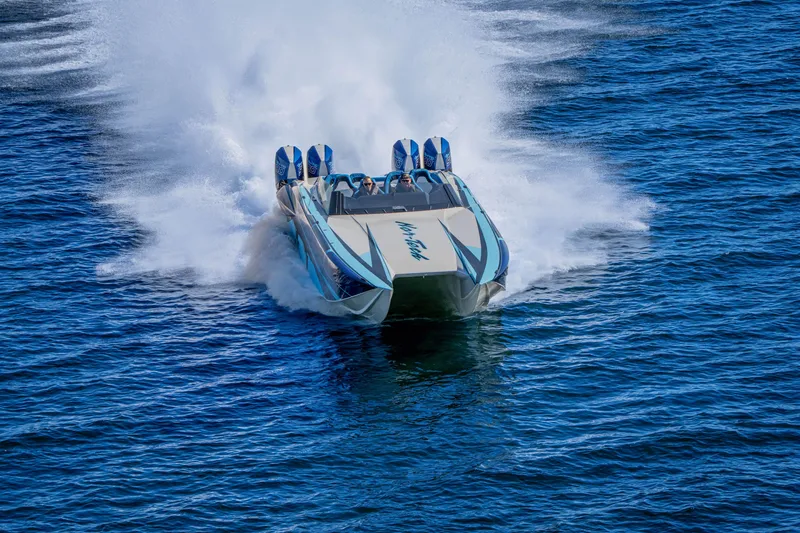 Slide: The Image of 2026 Nor-Tech 4000 Super Catamaran speeding on open water, creating a dramatic wake. - 35