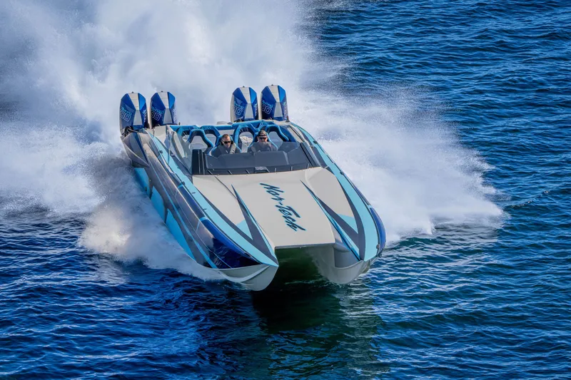 Slide: The Image of 2026 Nor-Tech 4000 Super Catamaran speeding on water, showcasing powerful performance and sleek design. - 36