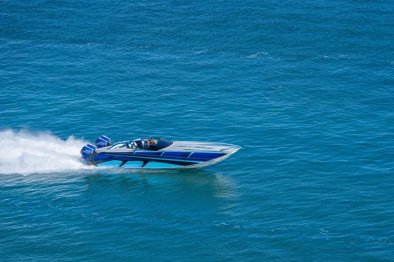 Slide: The Image of 2026 Nor-Tech 4000 Super Catamaran speeding on open blue water. - 37