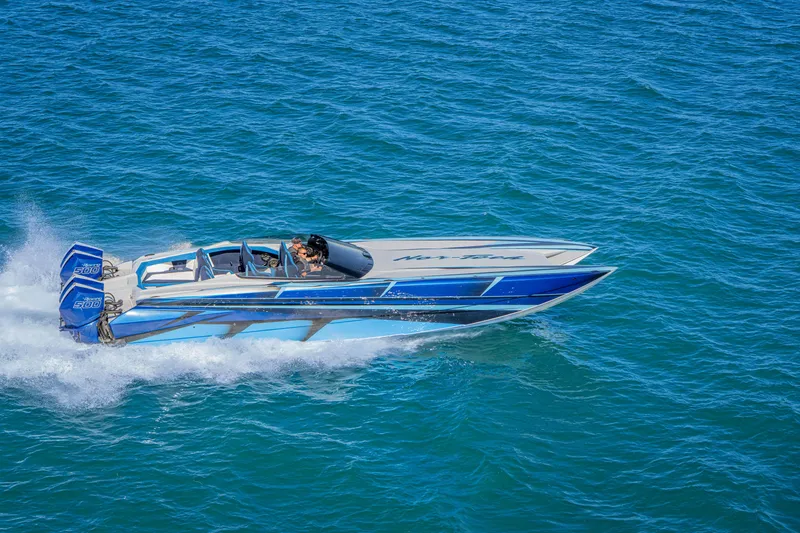 Slide: The Image of 2026 Nor-Tech 4000 Super Catamaran speeding on blue ocean waters. - 4