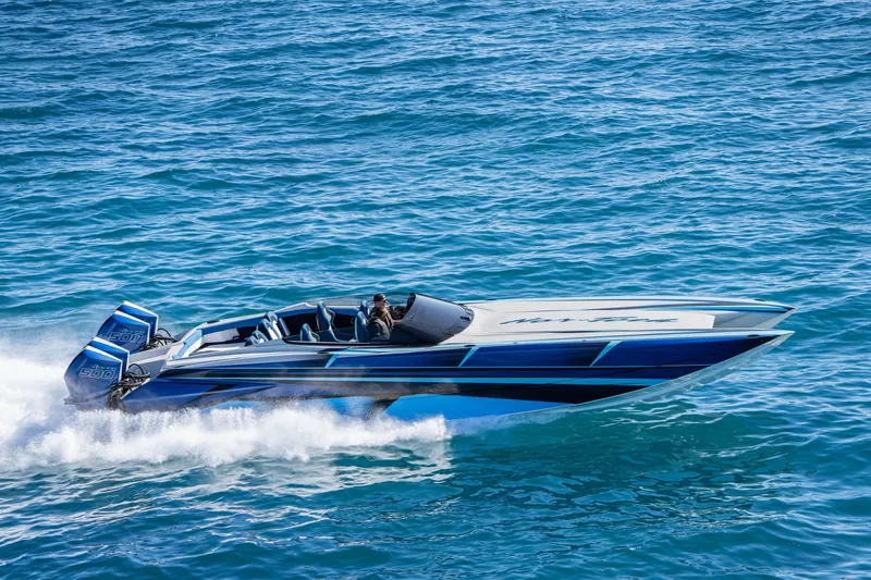 Slide: The Image of 2026 Nor-Tech 4000 Super Catamaran speeding on blue ocean waters. - 40