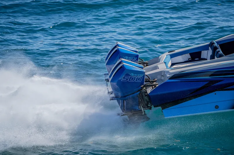 Slide: The Image of 2026 Nor-Tech 4000 Super Catamaran with dual Racing 500 engines on blue ocean. - 42