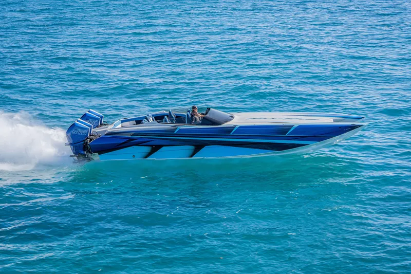 Slide: The Image of 2026 Nor-Tech 4000 Super Catamaran speeding on clear blue ocean waters. - 43