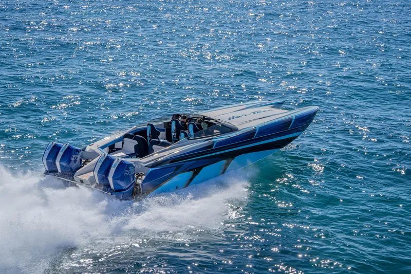 Slide: The Image of 2026 Nor-Tech 4000 Super Catamaran speeding on open water, showcasing sleek design and power. - 45
