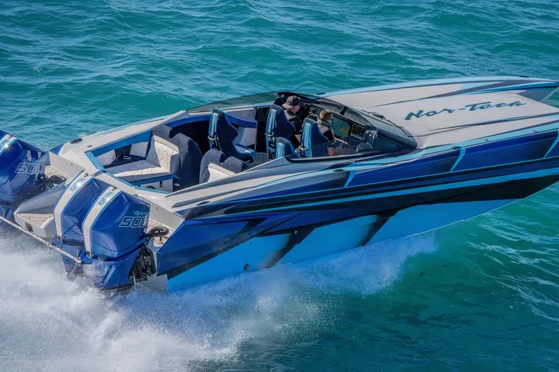 Slide: The Image of 2026 Nor-Tech 4000 Super Catamaran speeding on blue ocean waters. - 47