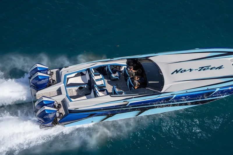 Slide: The Image of 2026 Nor-Tech 4000 Super Catamaran speeding on blue ocean waters. - 50