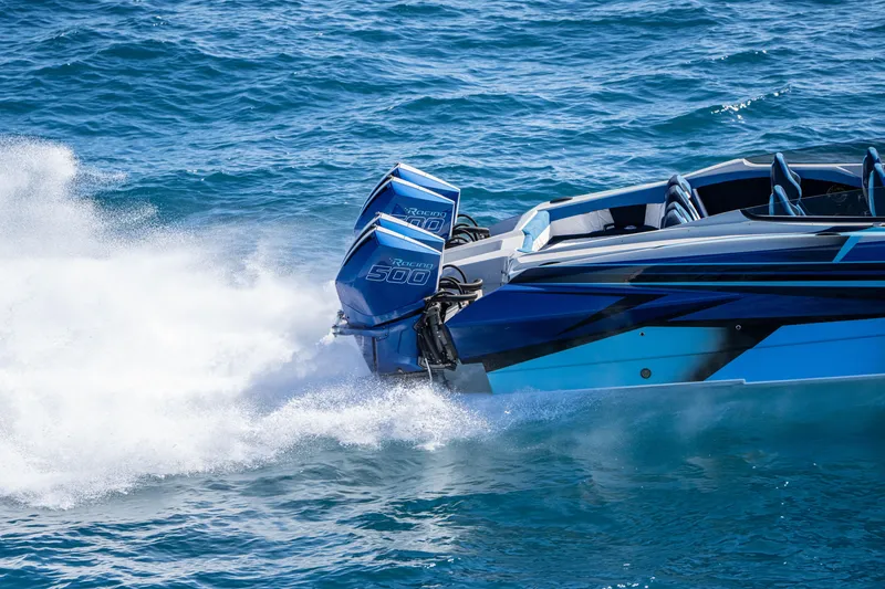 Slide: The Image of 2026 Nor-Tech 4000 Super Catamaran speeding on ocean with powerful engines. - 55