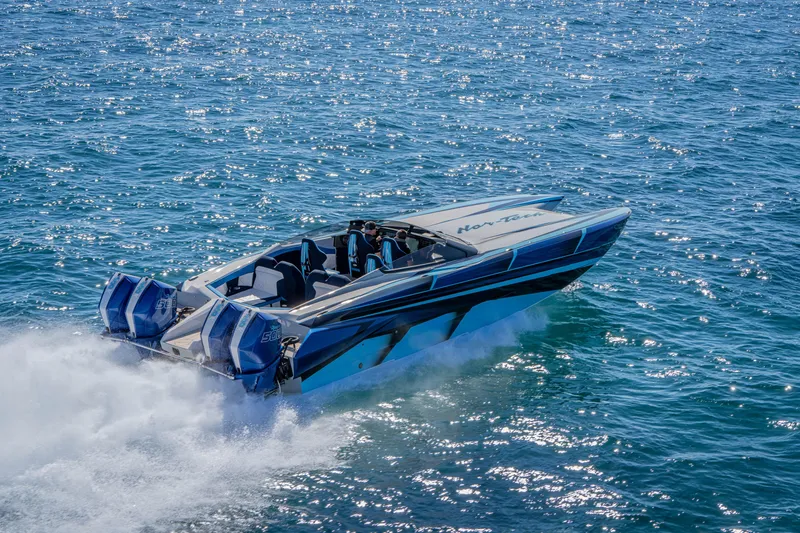 Slide: The Image of 2026 Nor-Tech 4000 Super Catamaran speeding on open water, showcasing sleek design and power. - 6