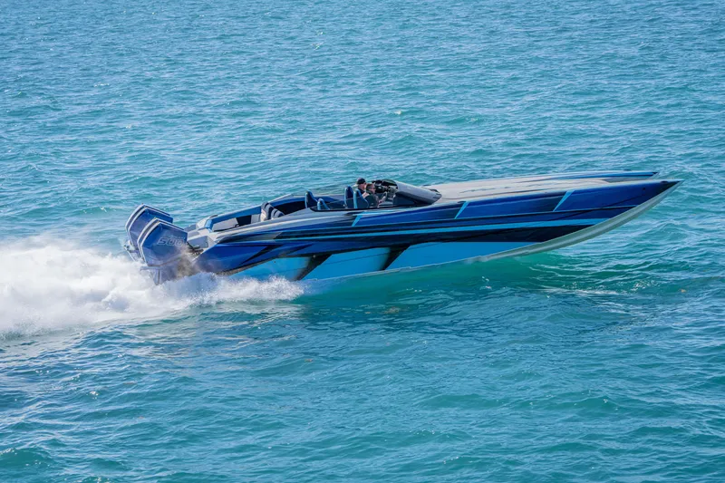 Slide: The Image of 2026 Nor-Tech 4000 Super Catamaran speeding on blue ocean waters. - 62