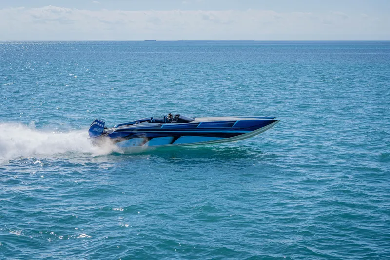 Slide: The Image of 2026 Nor-Tech 4000 Super Catamaran speeding on open water, showcasing sleek design. - 63