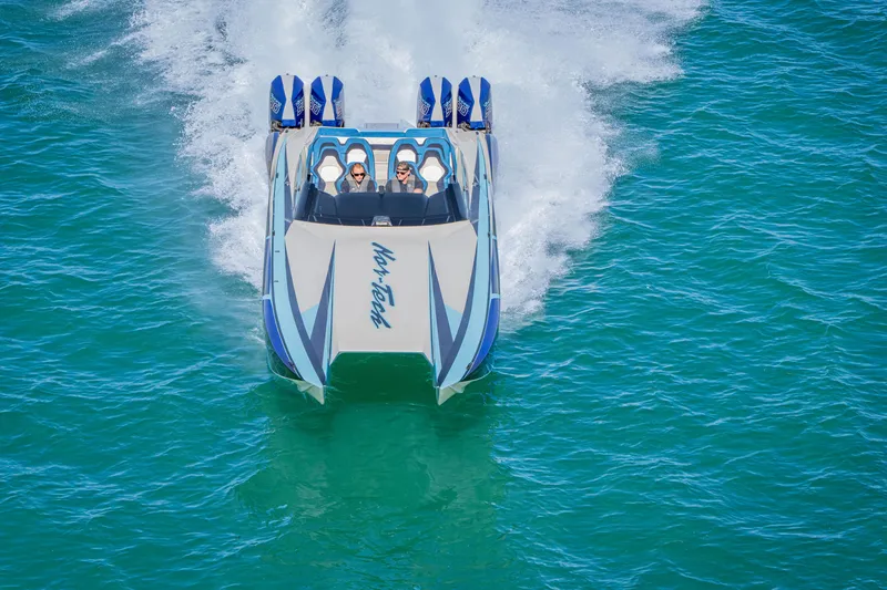 Slide: The Image of 2026 Nor-Tech 4000 Super Catamaran speeding on blue ocean waters. - 65