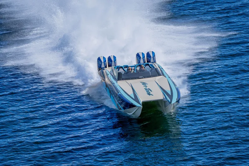 Slide: The Image of 2026 Nor-Tech 4000 Super Catamaran speeding on open water, creating a dramatic wake. - 66