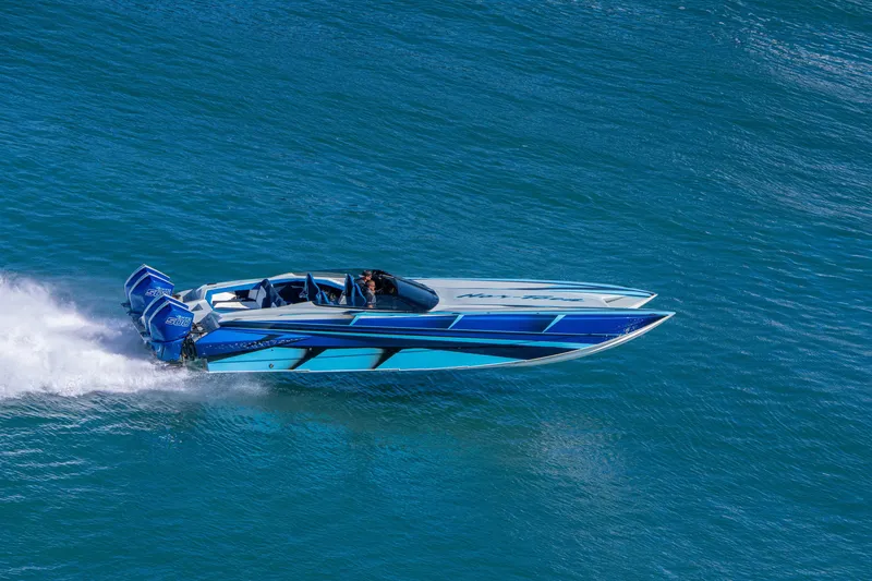 Slide: The Image of 2026 Nor-Tech 4000 Super Catamaran speeding on blue ocean waters. - 68