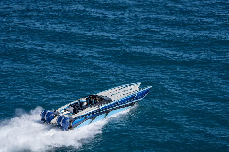 Slide: The Image of 2026 Nor-Tech 4000 Super Catamaran speeding on open water, showcasing sleek design and power. - 72