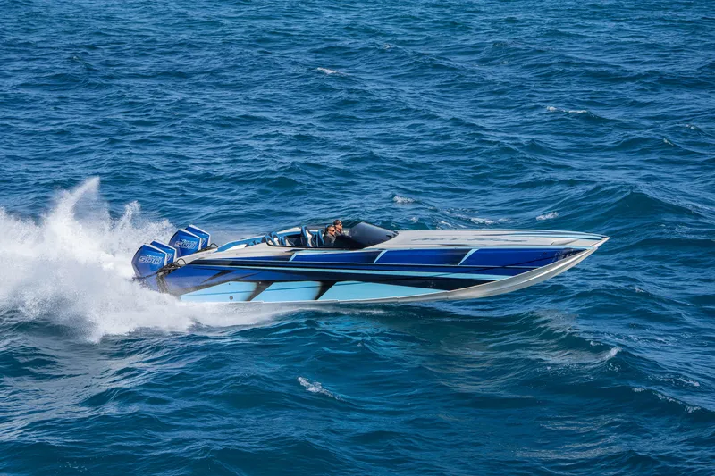 Slide: The Image of 2026 Nor-Tech 4000 Super Catamaran speeding on ocean waves. - 74