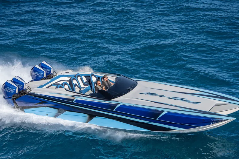 Slide: The Image of 2026 Nor-Tech 4000 Super Catamaran cruising on blue ocean waters. - 75