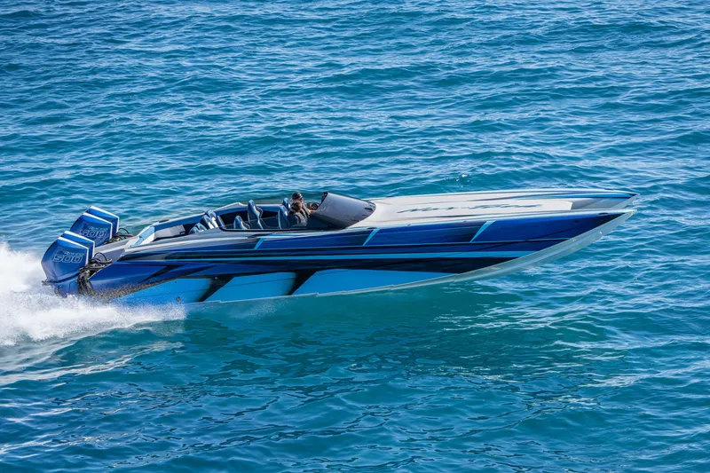 Slide: The Image of 2026 Nor-Tech 4000 Super Catamaran speeding on blue ocean waters. - 77