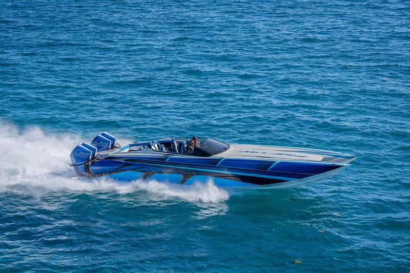 Slide: The Image of 2026 Nor-Tech 4000 Super Catamaran speeding on blue ocean waters. - 78