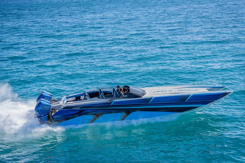 Slide: The Image of 2026 Nor-Tech 4000 Super Catamaran cruising on clear blue ocean waters. - 79