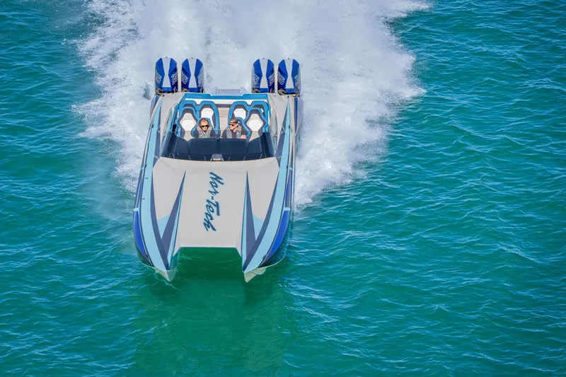 Slide: The Image of 2026 Nor-Tech 4000 Super Catamaran speeding on blue ocean waters. - 84