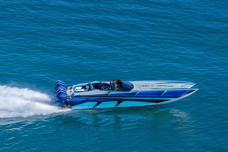 Slide: The Image of 2026 Nor-Tech 4000 Super Catamaran speeding on blue ocean waters. - 85