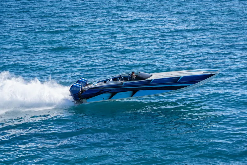 Slide: The Image of 2026 Nor-Tech 4000 Super Catamaran speeding on open water, showcasing sleek design. - 89