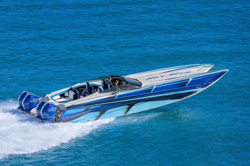 Slide: The Image of 2026 Nor-Tech 4000 Super Catamaran speeding on blue ocean waters. - 9
