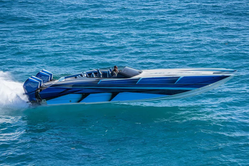 Slide: The Image of 2026 Nor-Tech 4000 Super Catamaran cruising on blue ocean waters. - 90