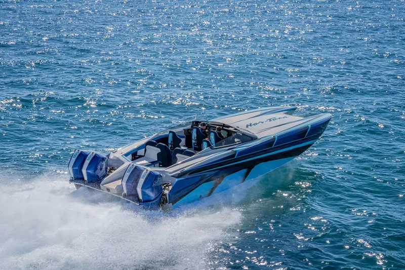 The Image of 2026 Nor-Tech 4000 Super Catamaran speeding on open water, showcasing sleek design and power. - 0