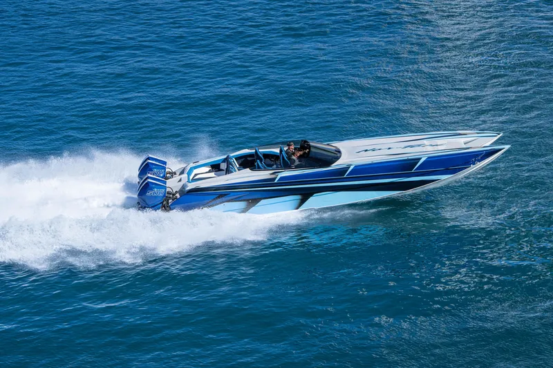 Slide: The Image of 2026 Nor-Tech 4000 Super Catamaran speeding on blue ocean waters. - 10
