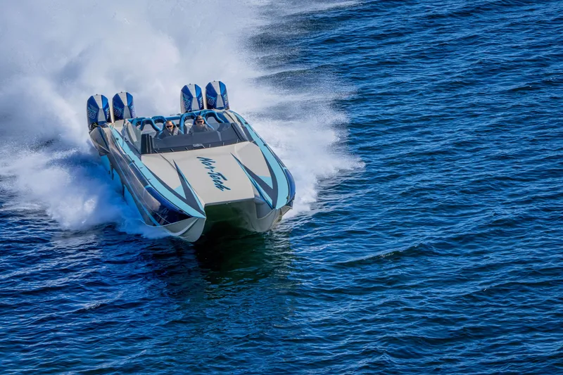 Slide: The Image of 2026 Nor-Tech 4000 Super Catamaran speeding on open water. - 115