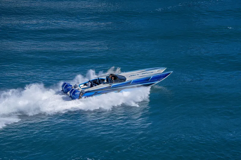 Slide: The Image of 2026 Nor-Tech 4000 Super Catamaran speeding on open water, showcasing sleek design. - 119