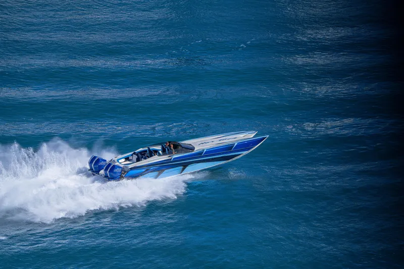 Slide: The Image of 2026 Nor-Tech 4000 Super Catamaran speeding on open blue water. - 120