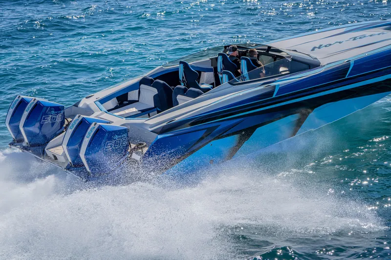 Slide: The Image of 2026 Nor-Tech 4000 Super Catamaran speeding on ocean waters, showcasing powerful engines. - 128