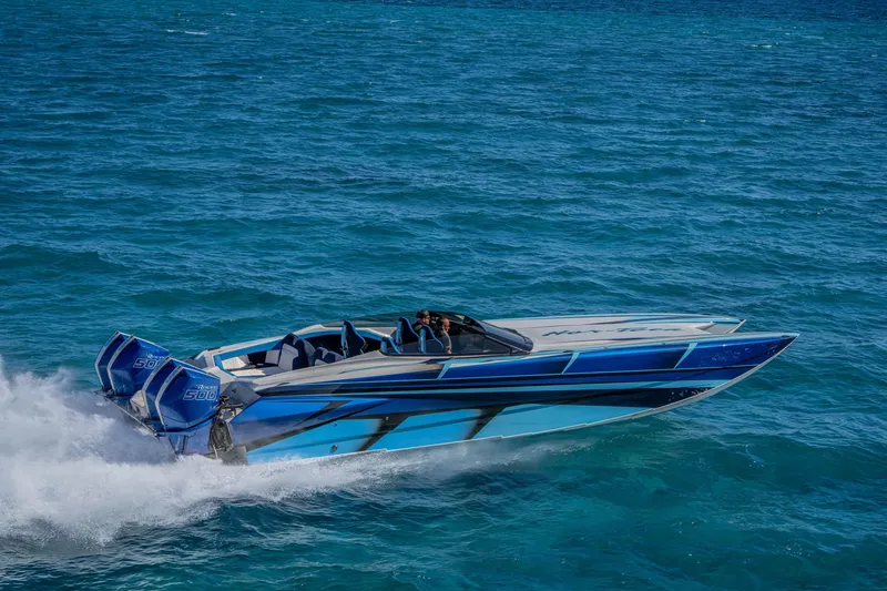 Slide: The Image of 2026 Nor-Tech 4000 Super Catamaran cruising on blue ocean waters. - 130