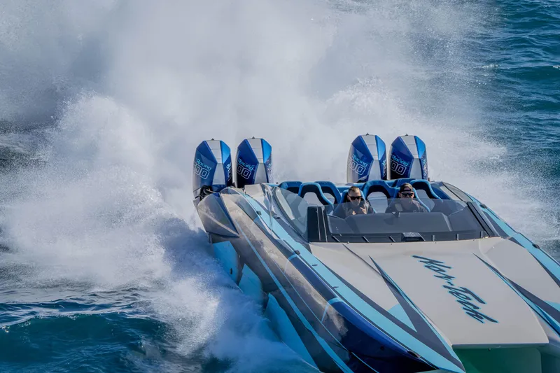 Slide: The Image of 2026 Nor-Tech 4000 Super Catamaran speeding on ocean waves, showcasing powerful engines. - 131