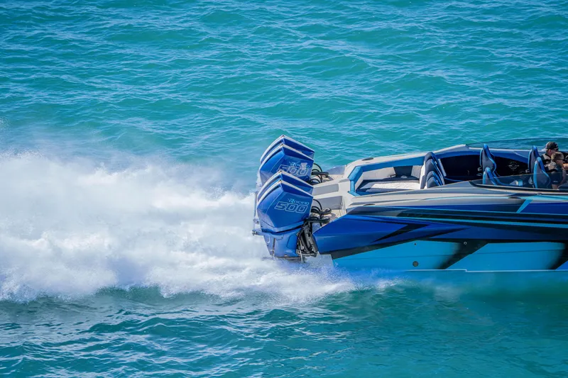 Slide: The Image of 2026 Nor-Tech 4000 Super Catamaran speeding on blue ocean waters. - 132