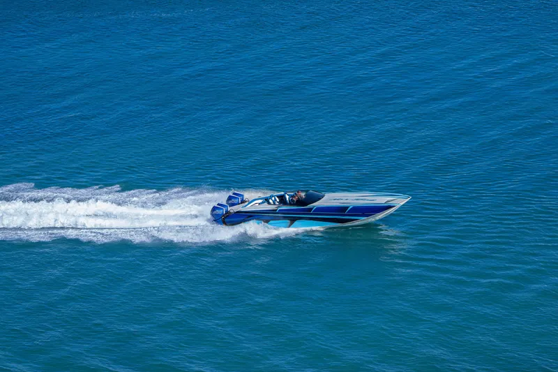 Slide: The Image of 2026 Nor-Tech 4000 Super Catamaran speeding on blue ocean waters. - 135