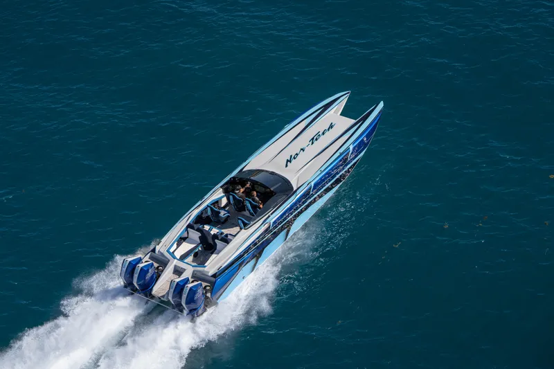 Slide: The Image of 2026 Nor-Tech 4000 Super Catamaran speeding on blue ocean waters. - 139