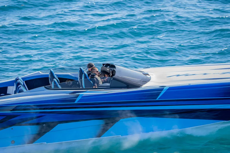 Slide: The Image of 2026 Nor-Tech 4000 Super Catamaran cruising on blue ocean waters. - 14