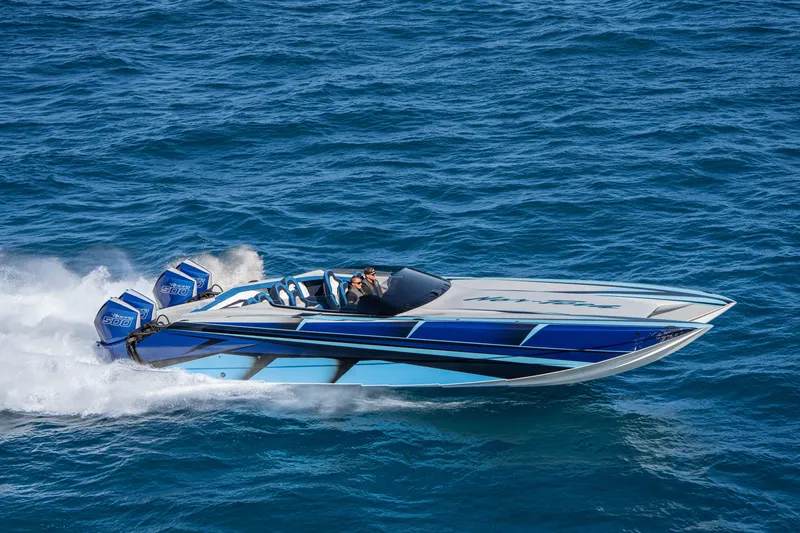 Slide: The Image of 2026 Nor-Tech 4000 Super Catamaran speeding on open water, showcasing sleek design and powerful engines. - 142