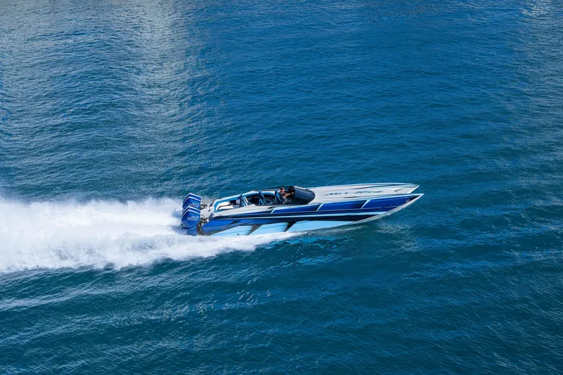 Slide: The Image of 2026 Nor-Tech 4000 Super Catamaran speeding on blue ocean waters. - 152