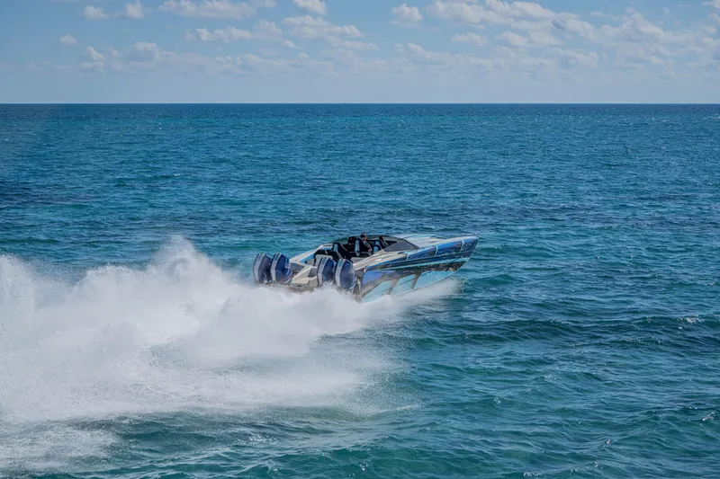 Slide: The Image of 2026 Nor-Tech 4000 Super Catamaran speeding on open ocean waters. - 159