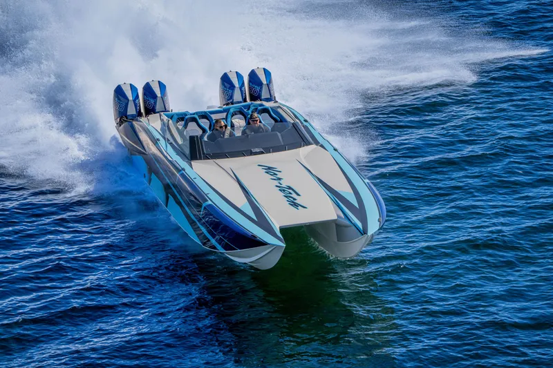Slide: The Image of 2026 Nor-Tech 4000 Super Catamaran speeding on water, showcasing sleek design and powerful engines. - 166