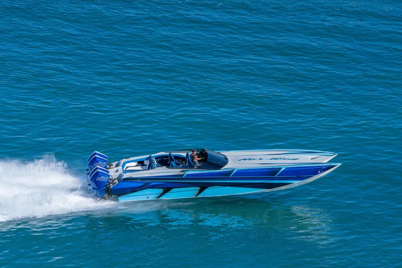 Slide: The Image of 2026 Nor-Tech 4000 Super Catamaran speeding on blue ocean waters. - 167